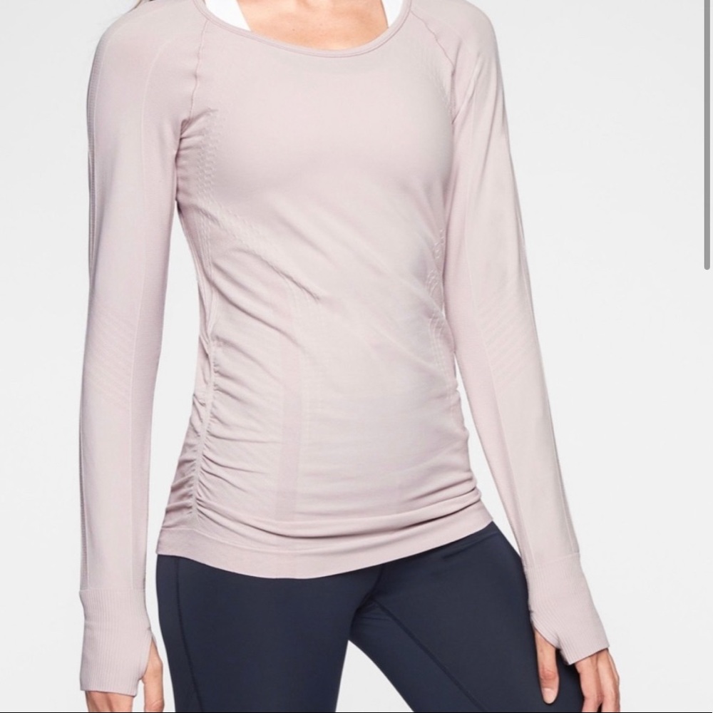 Womens long sleeve athletic top from Athleta. Size XS, scrunched detail on sides